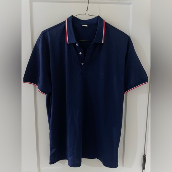 Navy polo with red trim, 100% polyester ￼ - Picture 2 of 3